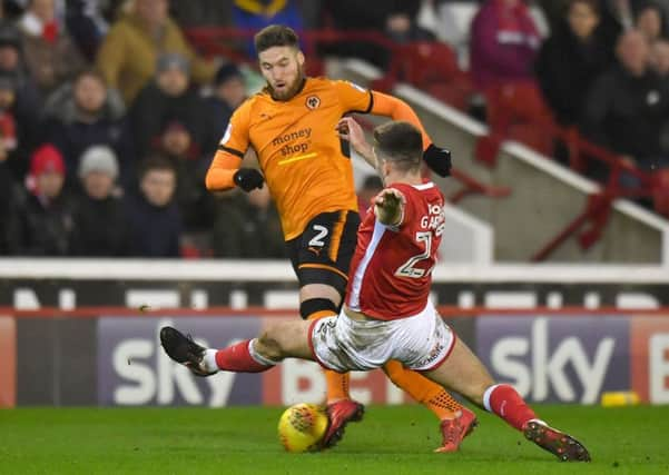 Wolverhampton Wanderers' Matt Doherty avoids a challenge from Barnsley's Gary Gardner.