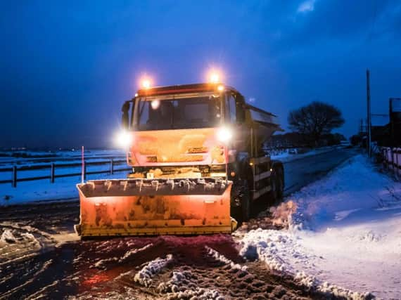 A gritter in snowy conditions near Snowden Hill in Sheffield - Credit: Danny Lawson/PA Wire