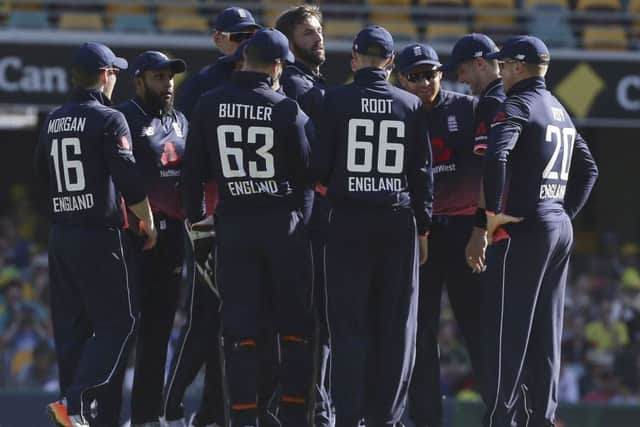 England's Liam Plunkett, centre. celebrates taking the wicket of Australia's Aaron Finch.