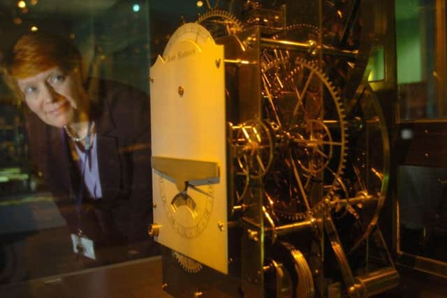 Head of the Royal Observatory Gloria Clifton looks at John Harrison's third timekeeper built between 1740-59, at the Royal Observatory in Greenwich, south-east London, Tuesday February 14, 2006. The Royal Observatory Greenwich is to open four new galleries to tell the story of precise timekeeping. They will include a new horology conservation studio where for the first time visitors will be able to watch conservators at work on some of the world's most historically significant and complex clocks. See PA story TECHNOLOGY Clock. PRESS ASSOCIATION PHOTO. Photo credit should read: Johnny Green/PA.