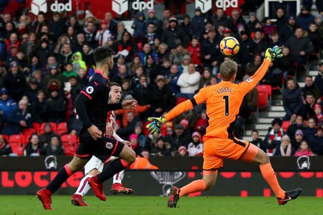 Stoke City's Xherdan Shaqiri gets in a shot on the Huddersfield goal. Picture: Nigel French/PA