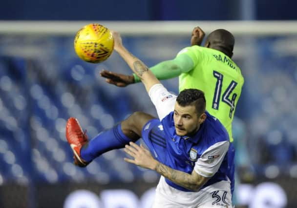 Owls Daniel Pudil upagainst Citys Sol Bamba...Pic Steve Ellis