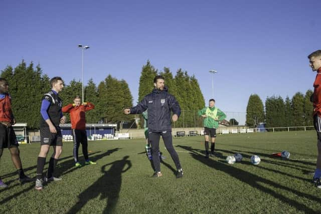 The squad of the Yorkshire International Football Association in training at Hemsworth Miners FC.