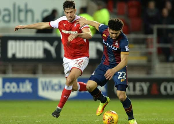 Derby battle: Nathaniel Knight-Percival holds off Millers scorer Joe Newell.  Picture: Bruce Rollinson