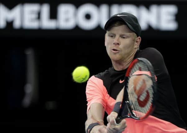 DENIED: Kyle Edmund makes a backhand return to Marin Cilic in their Melbourne semi-final. Picture: AP/Dita Alangkara