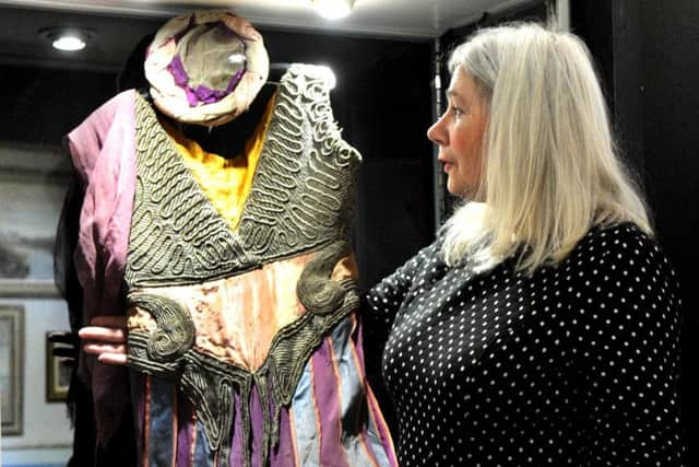 Ruth Cope with a costume  designed by Leon Bakst for the 1910 production 'Scheherazade' by the Ballets Russes