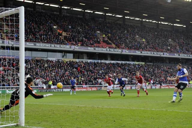 Sheffield Wednesday's Atdhe Nuhiu gives the visitors the lead against Barnsley at Oakwell from the penalty spot (Picture: Steve Ellis).