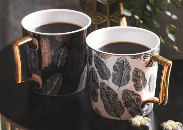 Fox and Ivy table, Â£49, and mugs, Â£5 each.