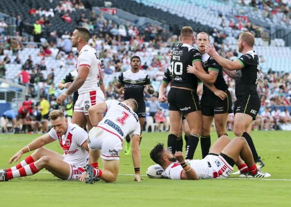 Hull FC's Liam Watts is congratulated on scoring a try against the Illawarra Dragons. Picture by David Neilson/SWpix.com/PhotosportNZ