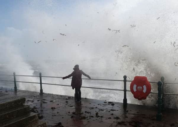 A woman faces Hurricane Ophelia head on. Ben Birchall/PA Wire