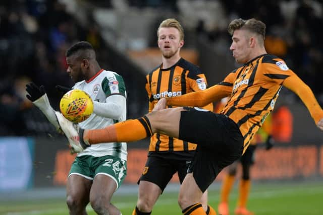 Danger averted: Angus MacDonald clears from Mamadou Thiam.