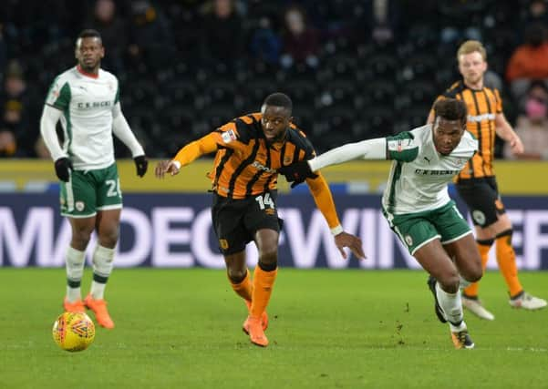 Hull Citys Adama Diomande, left, and Dimitri Cavatre, of Barnsley, duel for the ball during Tuesdays 1-1 Championship draw at KCOM Stadium (Picture: Bruce Rollinson).