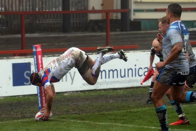 Trinity's winger Ben Jones-Bishop goes over in the corner to register a first half try. Picture Tony Johnson.