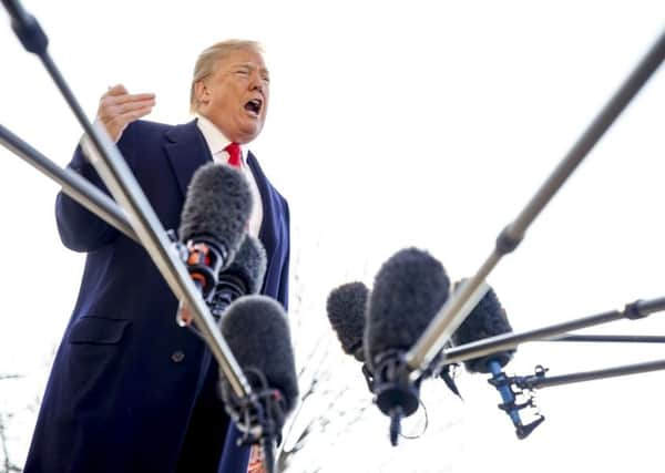 President Donald Trump speaks to reporters after sacking Rex Tillerson as US Secretary of State.