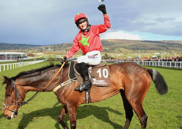 Harry Cobden celebrates after landing the Albert Bartlett Hurdle on Kilbricken Storm.