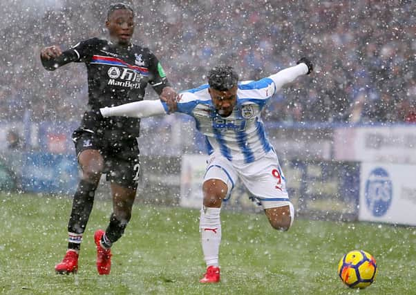 Crystal Palace's Aaron Wan-Bissaka (left) and Huddersfield Town's Elias Kachunga.