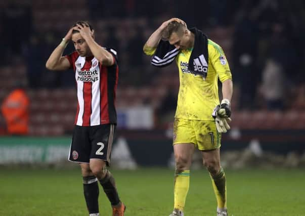 SO CLOSE: Sheffield United's George Baldock, left, and Simon Moore show their frustration over Monday night's draw at Bramall Lane. Picture: Simon Bellis/Sportimage