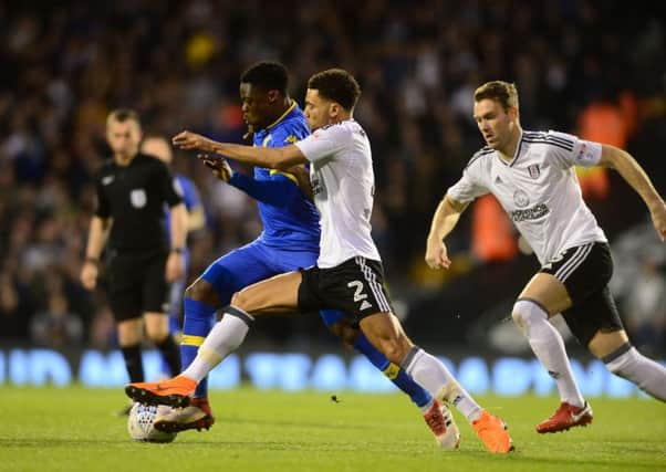 Leeds United's Caleb Ekuban battles for the ball with Fulham's Ryan Fredericks. Picture: James Hardisty.