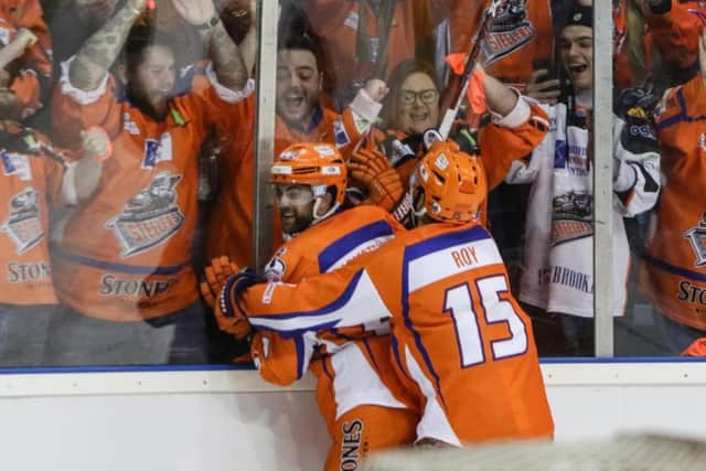 YOU BEAUTY: John Armstrong gets a hug from Mathieu Roy afdter scoring his overtime winn er against Nottingham panthers. Picture: EIHL.