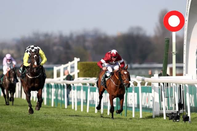 Tiger Roll ridden by jockey Davy Russell (right) wins the Randox Health Grand National Handicap Chase ahead of Pleasant Company ridden by jockey David Mullins.