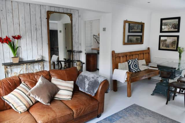 The panelling was cheaper than paying a plasterer.Tthe sofa is a new buy and the dining table is an old French  enamelled stove with a glass top.