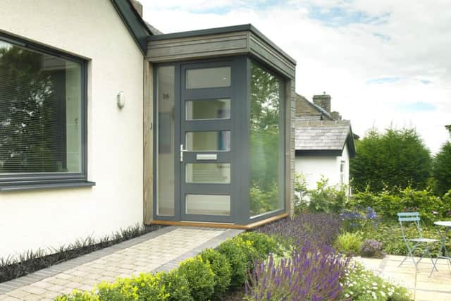 The new, glazed entrance has created extra space and helps bring natural  light into the property.