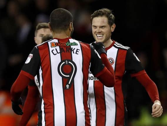 Richard Stearman celebrates with Leon Clarke. (Picture: PA)