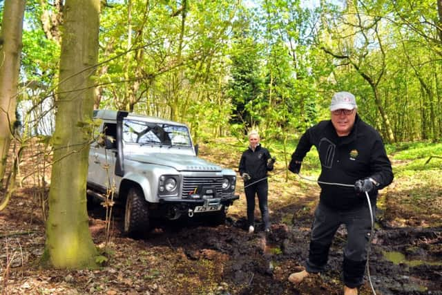 Libby and her dad Russ using a winch on one of the 4x4s.