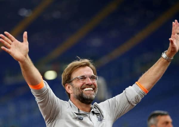 Liverpool manager Jurgen Klopp walks out to meet the Liverpool fans after reaching the Champions League Final. Picture: Steven Paston/PA