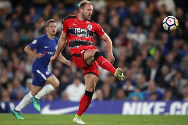 Huddersfield Town's Laurent Depoitre scores his side's goal against Chelsea at Stamford Bridge. Picture: John Walton/PA