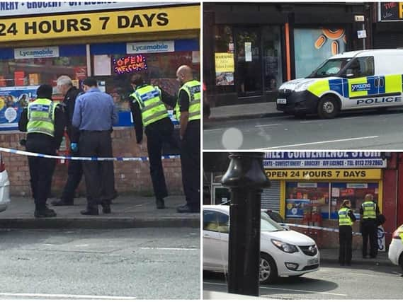 Police at the scene following the armed robbery in Armley Town Street.