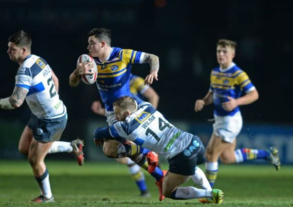 Jordan Lilley is held by Matty Wildie.
Featherstone Rovers v Leeds Rhinos.  Pre-Season Friendly.  Lo Nutrition Stadium.  Post Office Road.
26 January 2018.  Picture Bruce Rollinson