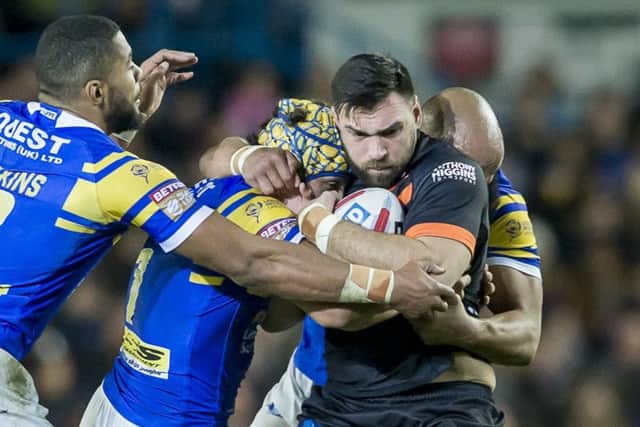 Castleford's Matt Cook is tackled by Leeds's Ash Golding and Carl Ablett (Picture: SWPix.com)